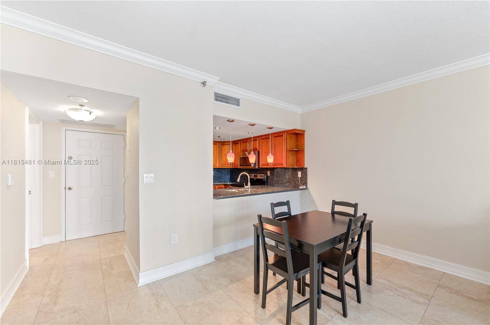 540 Brickell Key Drive, Unit 600 Miami, FL 33131 - Photo 5 of 28 a view of a dining room with furniture