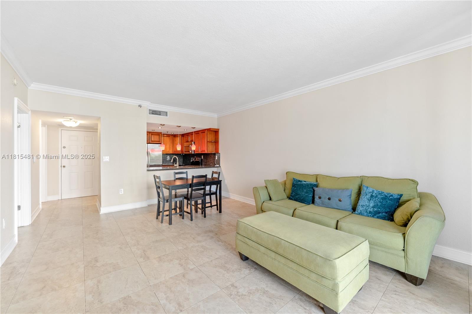 540 Brickell Key Drive, Unit 600 Miami, FL 33131 - Photo 6 of 28 a living room with furniture and a dining table with kitchen view