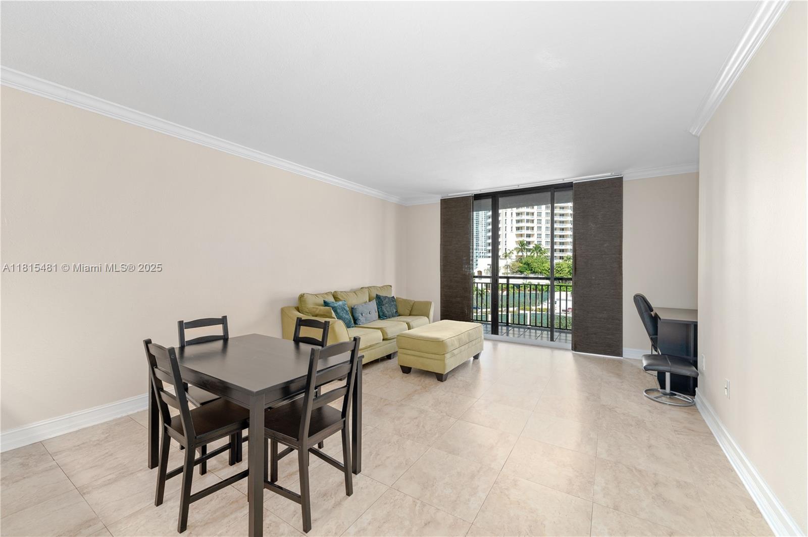 540 Brickell Key Drive, Unit 600 Miami, FL 33131 - Photo 7 of 28 a living room with furniture and a window