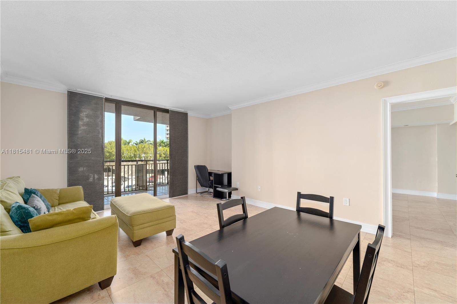 540 Brickell Key Drive, Unit 600 Miami, FL 33131 - Photo 8 of 28 a living room with furniture and a table