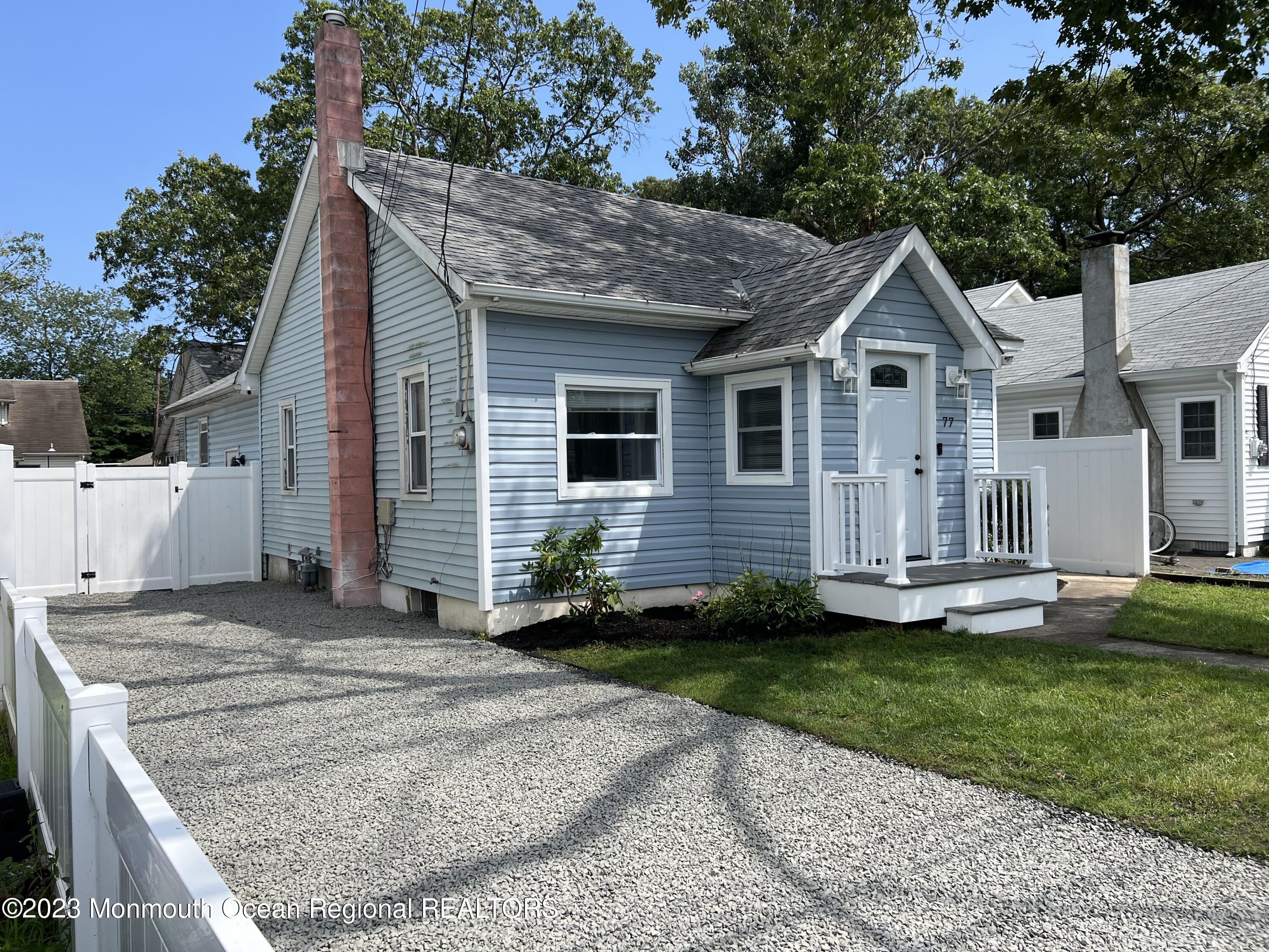 77 London Road Brick, NJ 08723 - Photo 1 of 10 a front view of a house with a yard
