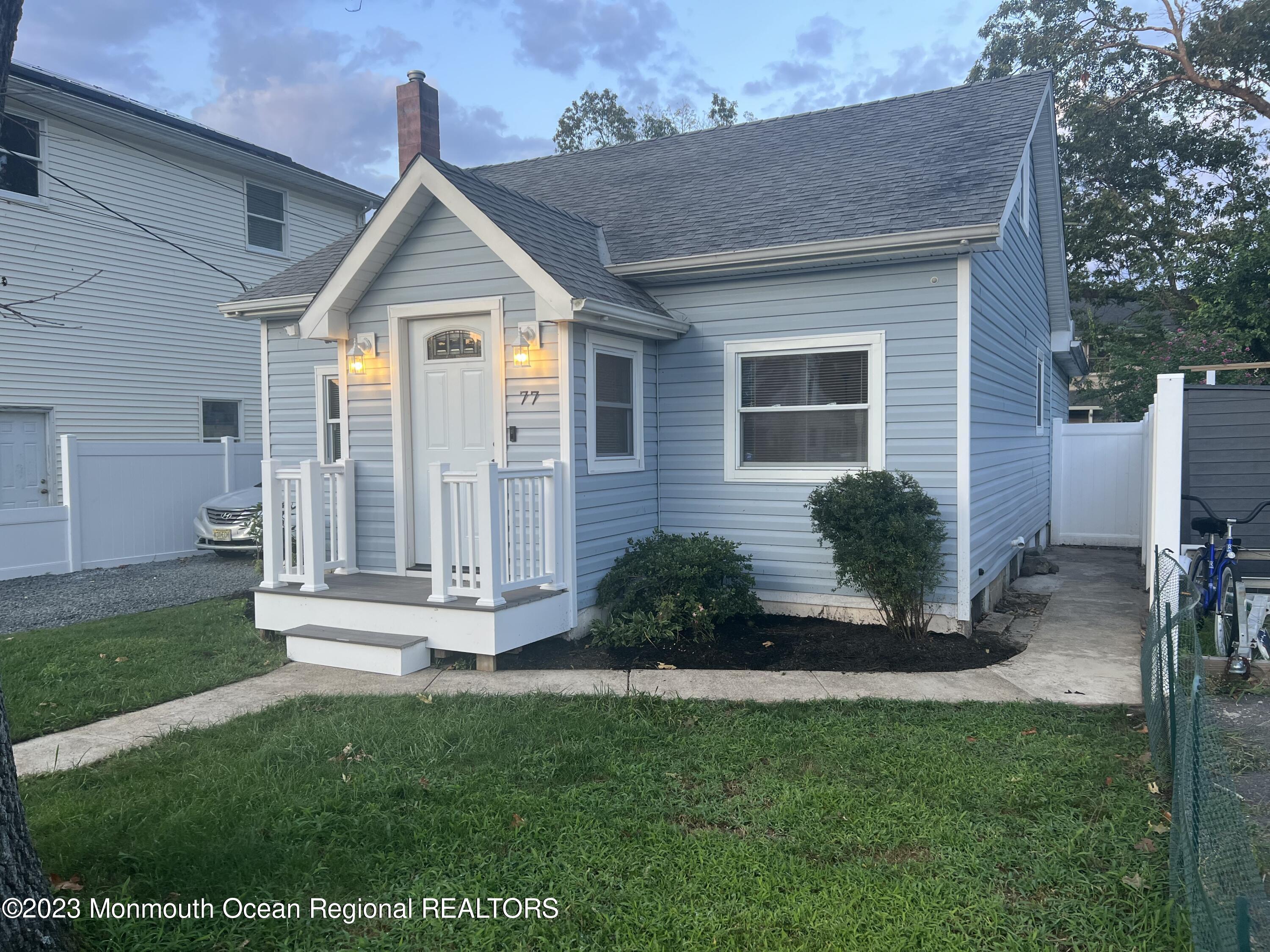 77 London Road Brick, NJ 08723 - Photo 2 of 10 a front view of a house with a yard
