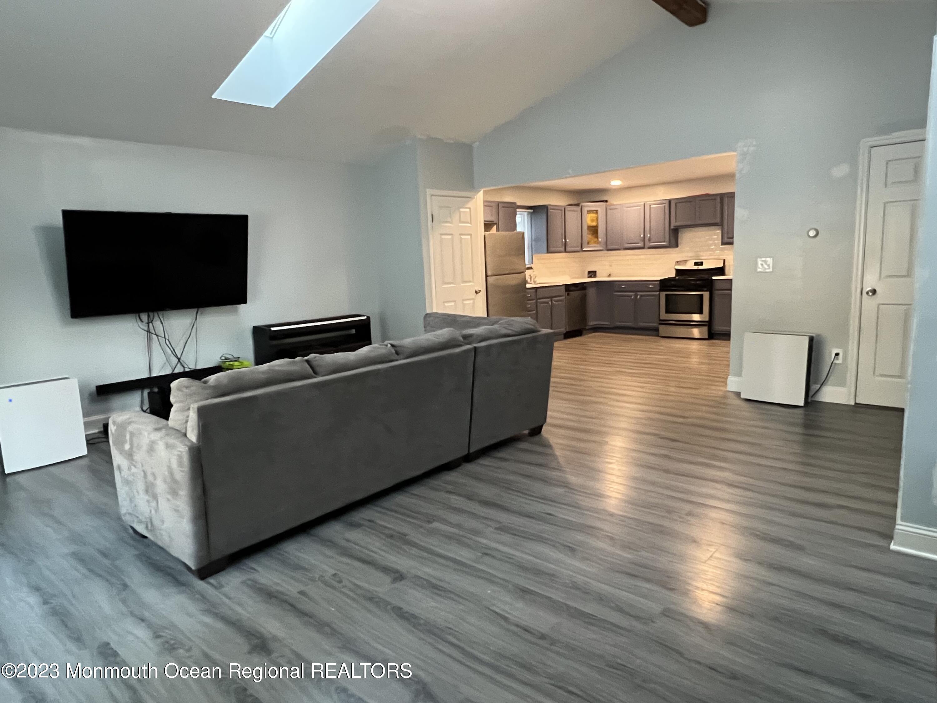 77 London Road Brick, NJ 08723 - Photo 6 of 10 a living room with furniture and a flat screen tv