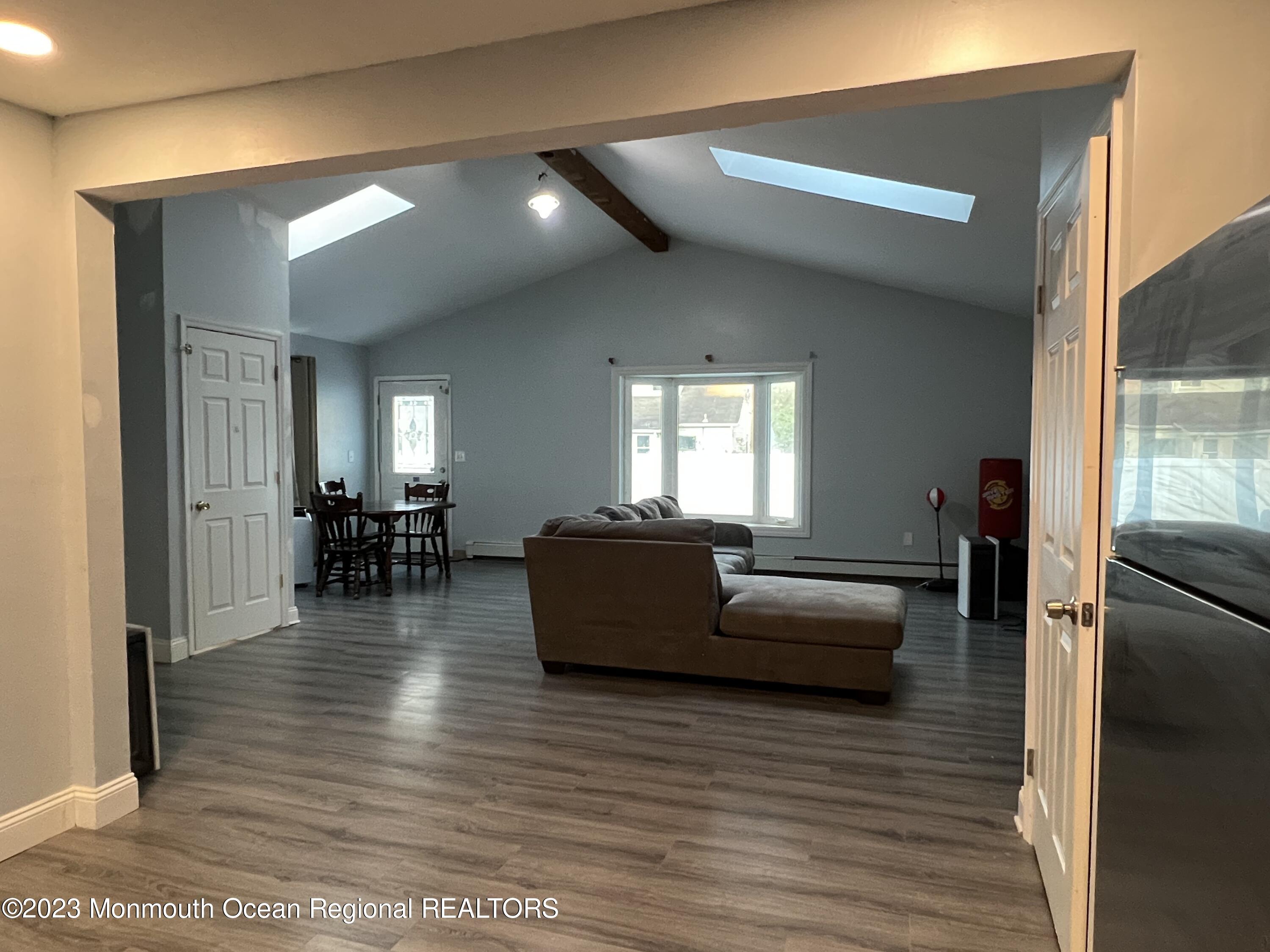 77 London Road Brick, NJ 08723 - Photo 8 of 10 a living room with furniture and a wooden floor
