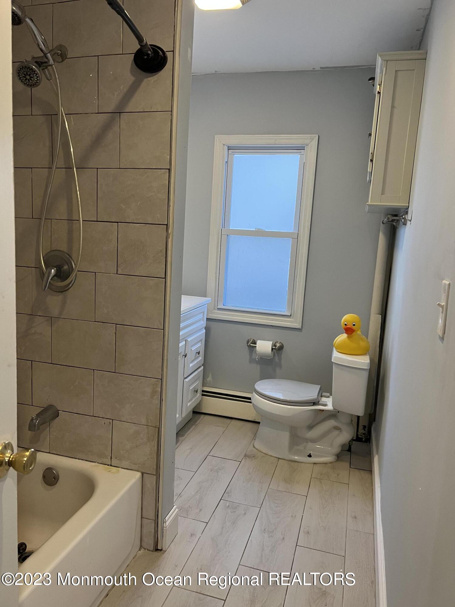 77 London Road Brick, NJ 08723 - Photo 9 of 10 a bathroom with a sink toilet and shower