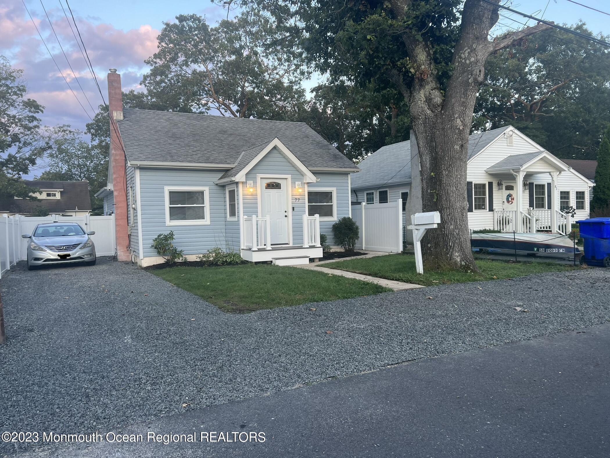 77 London Road Brick, NJ 08723 - Photo 10 of 10 a front view of a house with a garden and trees