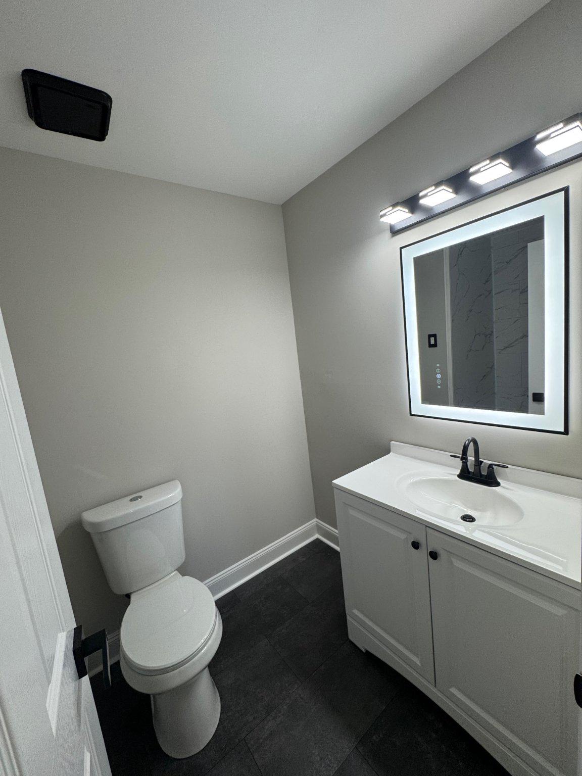 8 Framingham Road Beverly, NJ 08010 - Photo 23 of 35 a bathroom with a toilet sink and mirror
