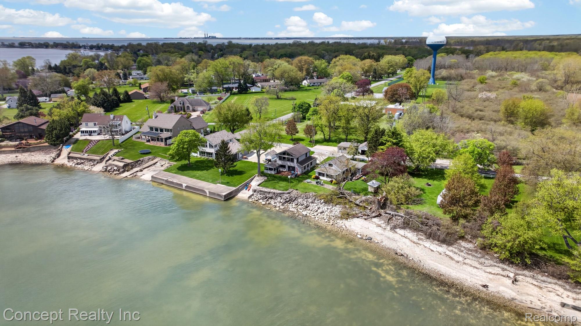 4720 Long Road Newport, MI 48166 - Photo 40 of 46 Aerial view of residential area featuring a large body of water and a tree filled landscape