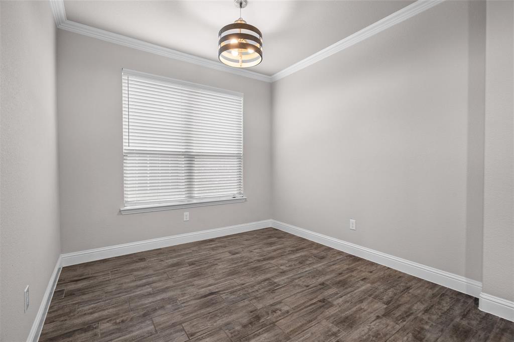 119 Happy Lane Red Oak, TX 75154 - Photo 6 of 37 Neutral tone wall paint with crown molding and baseboards
