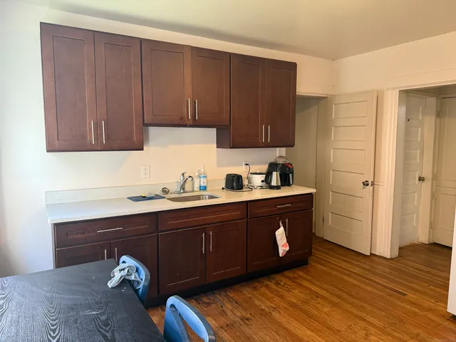 a kitchen with wooden cabinets and sink