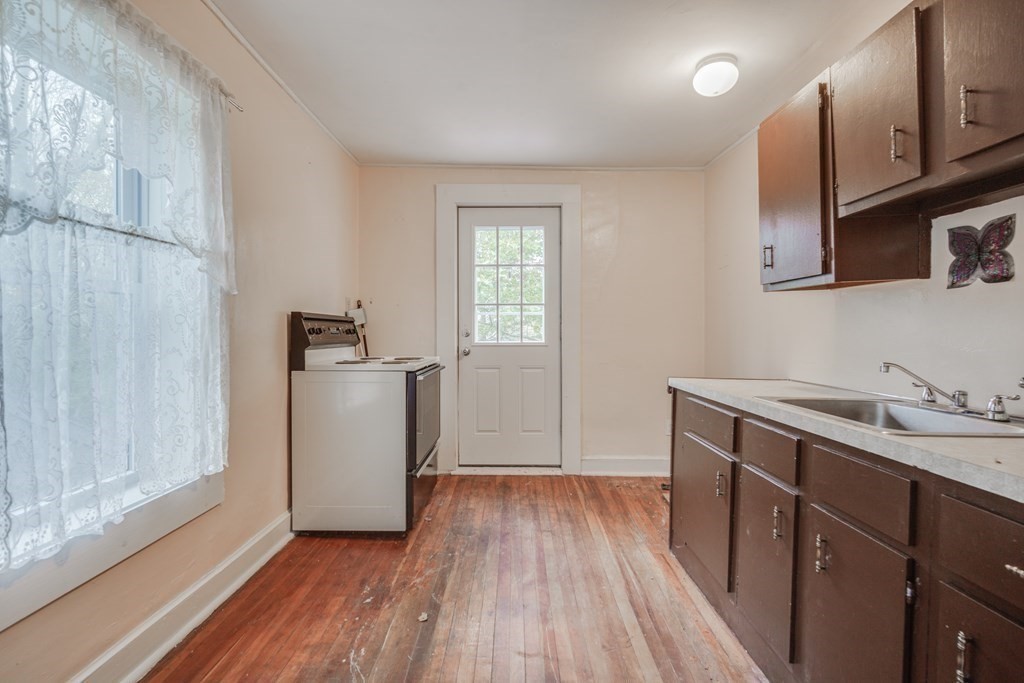 122 Sandisfield Road Sandisfield, MA 01255 - Photo 17 of 41 a view of a kitchen with wooden floor and electronic appliances