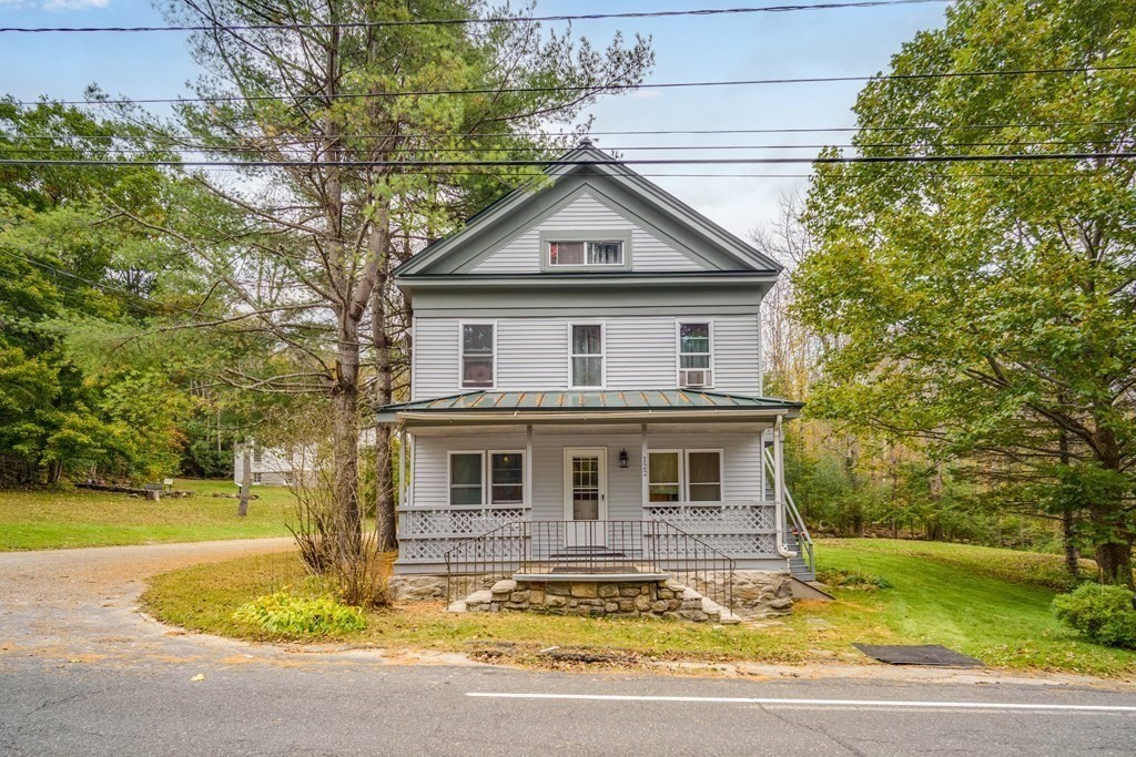 122 Sandisfield Road Sandisfield, MA 01255 - Photo 2 of 41 a front view of a house with garden