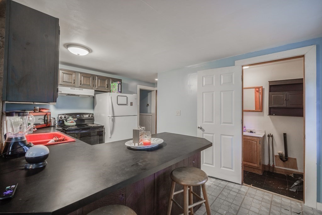 122 Sandisfield Road Sandisfield, MA 01255 - Photo 30 of 41 a kitchen with a sink cabinets and appliances