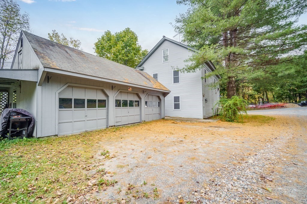 122 Sandisfield Road Sandisfield, MA 01255 - Photo 36 of 41 a front view of a house with a garden