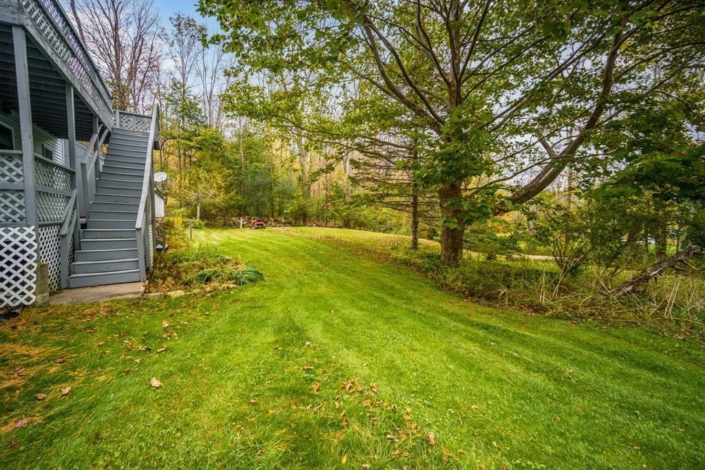 122 Sandisfield Road Sandisfield, MA 01255 - Photo 38 of 41 a backyard of a house with large trees