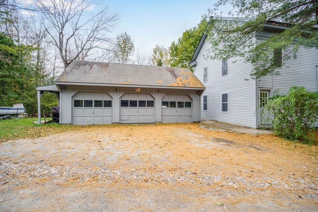 122 Sandisfield Road Sandisfield, MA 01255 - Photo 4 of 41 a front view of a house with a yard