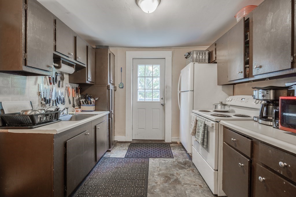 122 Sandisfield Road Sandisfield, MA 01255 - Photo 5 of 41 a kitchen with a sink stove and refrigerator