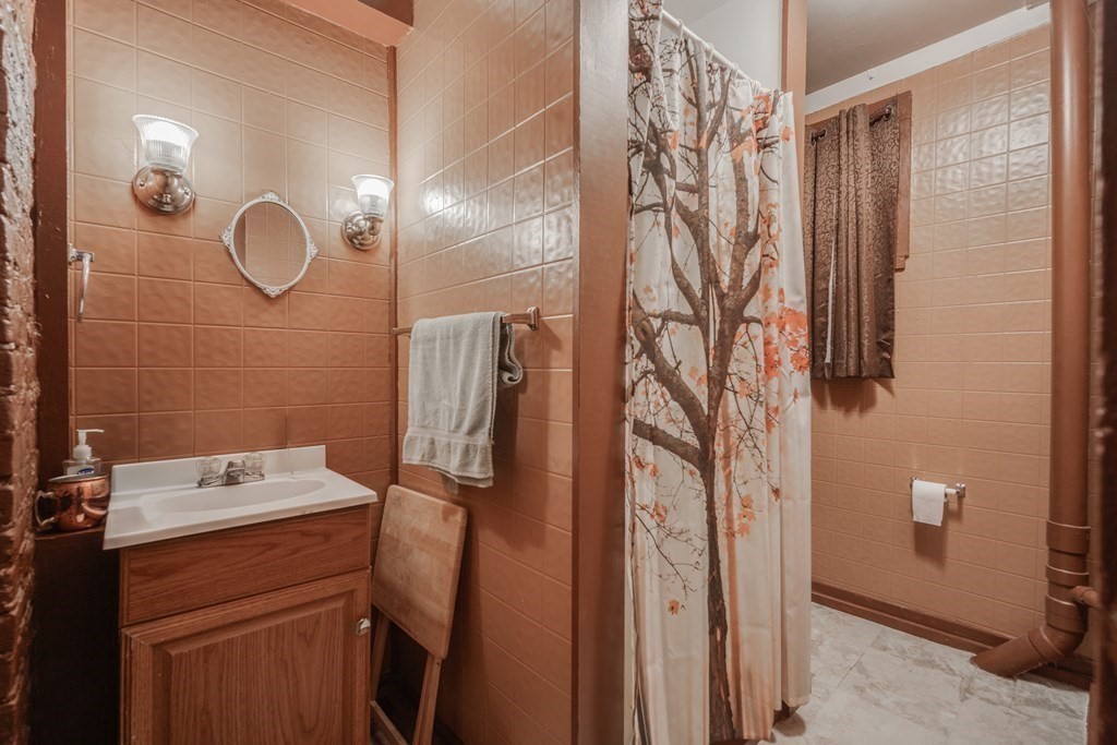 122 Sandisfield Road Sandisfield, MA 01255 - Photo 8 of 41 a bathroom with a sink and mirror