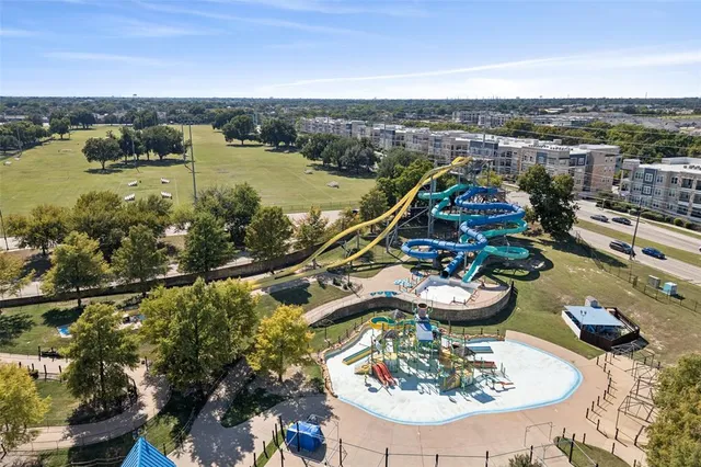 an aerial view of a swimming pool and outdoor space