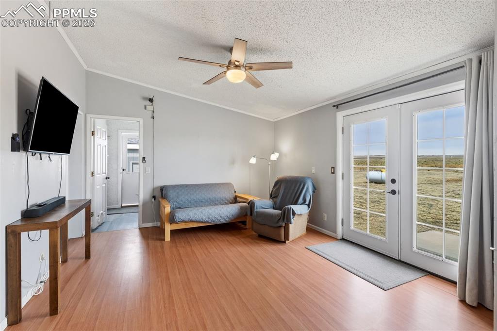 27560 Mid Jones Road Calhan, CO 80808 - Photo 16 of 34 French Doors Lead to Back Patio