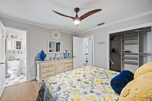 a bedroom with a bed and a dresser