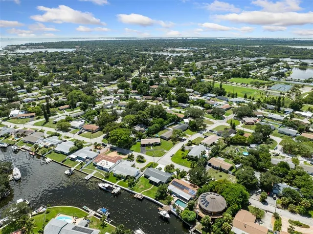 an aerial view of residential houses with outdoor space