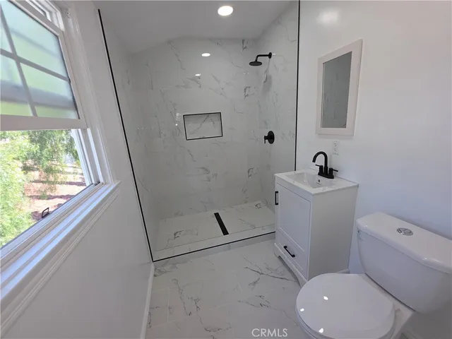 a bathroom with a toilet sink and tub
