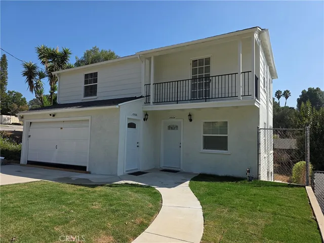 a house view with a garden space