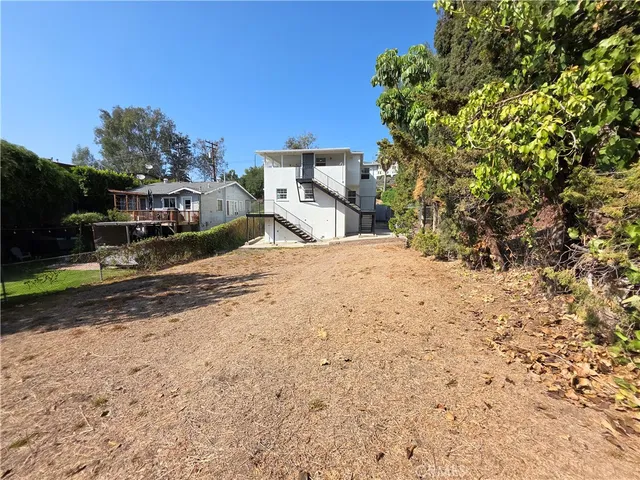 a view of a backyard of a house