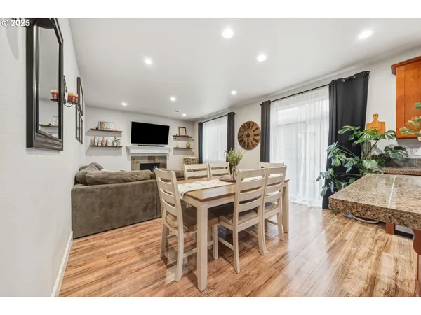 a view of a dining room with furniture window and wooden floor