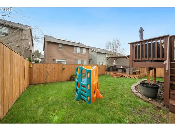 a view of a backyard with furniture