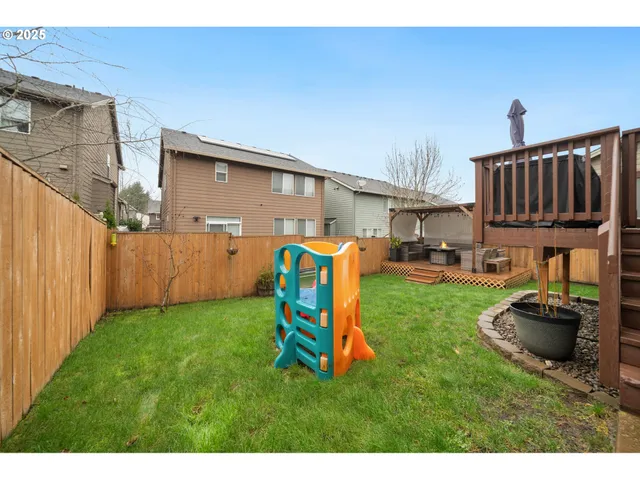 a view of a backyard with furniture
