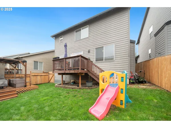 a view of a backyard with a slide