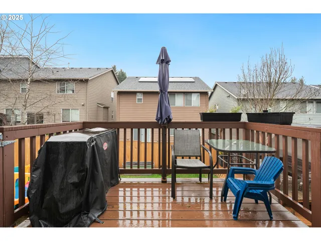 a view of a chairs and table in the balcony