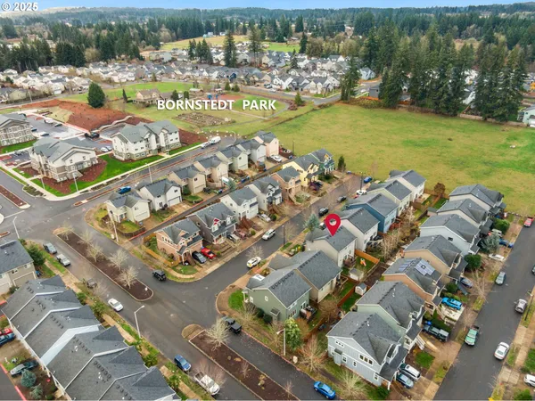 an aerial view of residential houses with outdoor space