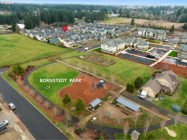 an aerial view of a pool patio lake and mountain view