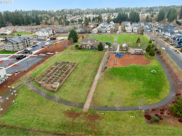an aerial view of a pool patio lake and mountain view