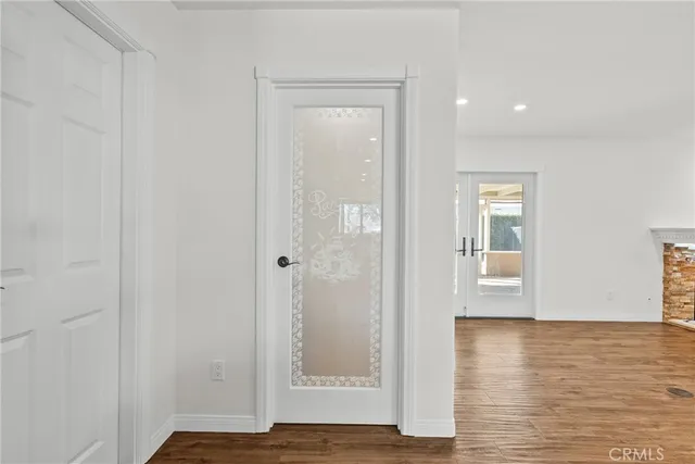 a view of room with window and wooden floor
