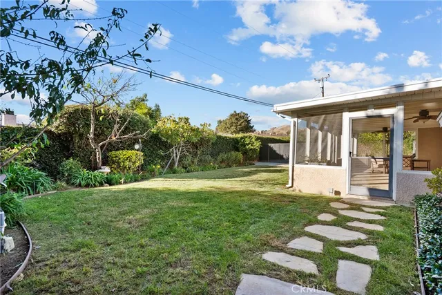 a view of a swimming pool with a yard