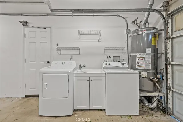 an aerial view of a house with a yard and lake view
