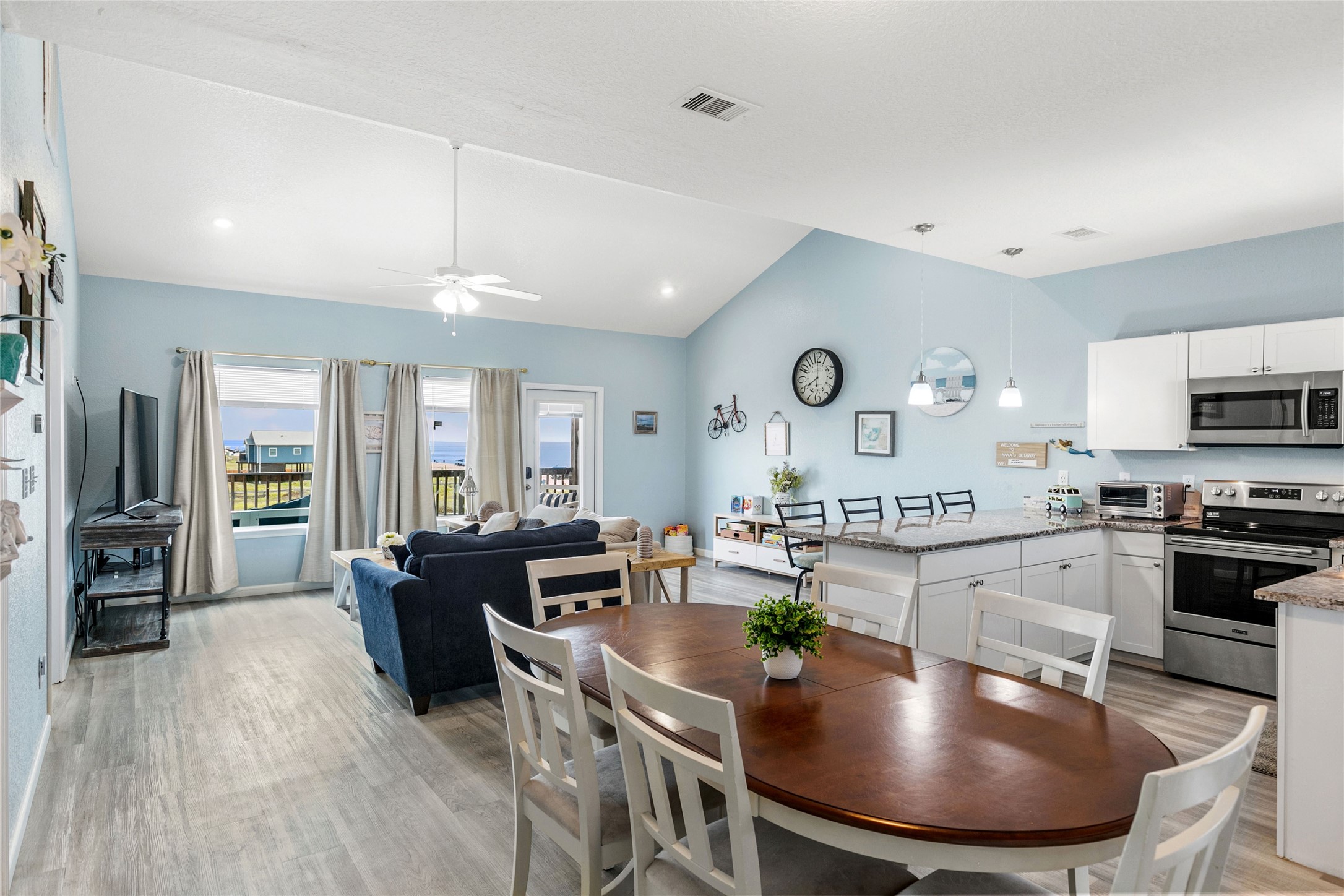 124 Howard Avenue, Unit A Surfside Beach, TX 77541 - Photo 13 of 36 a large kitchen with a table and chairs