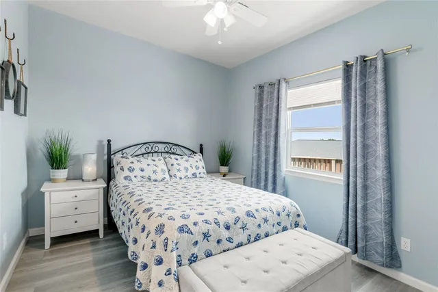 a bedroom with a bed and a chair