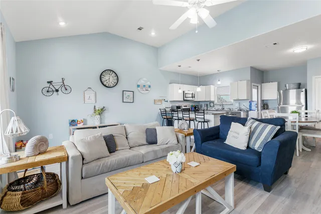 a large kitchen with a table and chairs