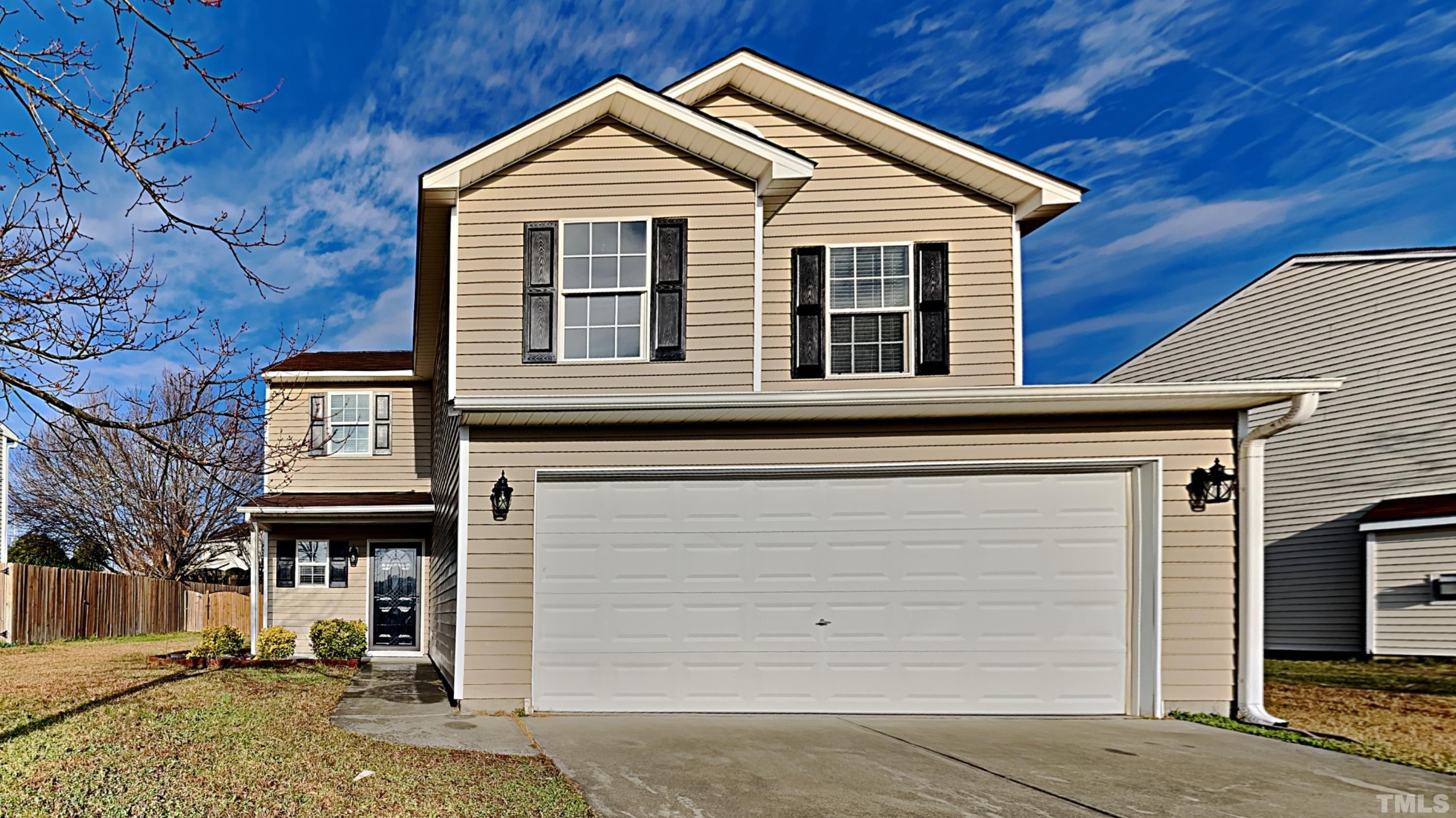 a front view of a house with a garage