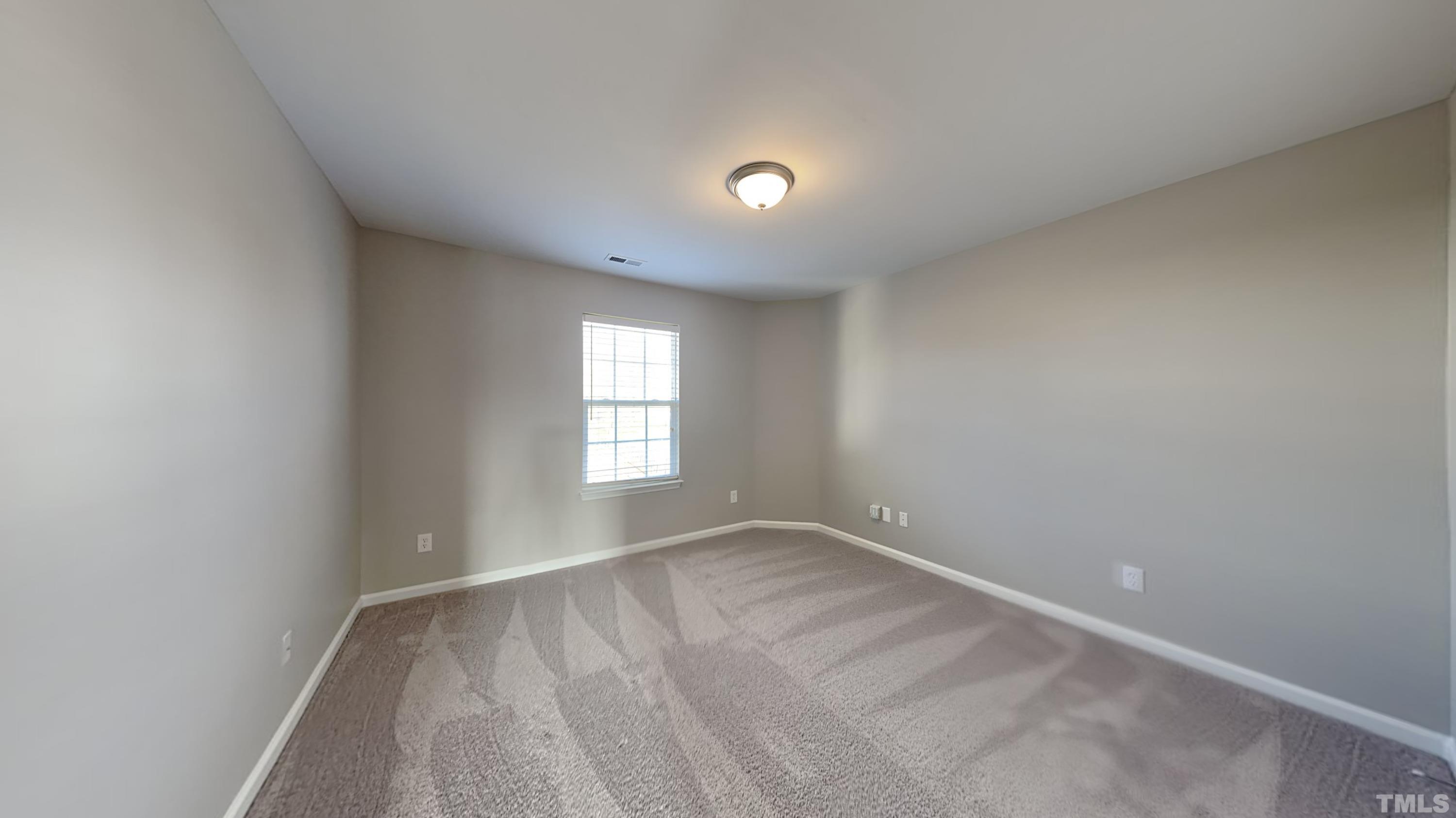 4105 Springfield Creek Drive Raleigh, NC 27616 - Photo 11 of 12 an empty room with a window