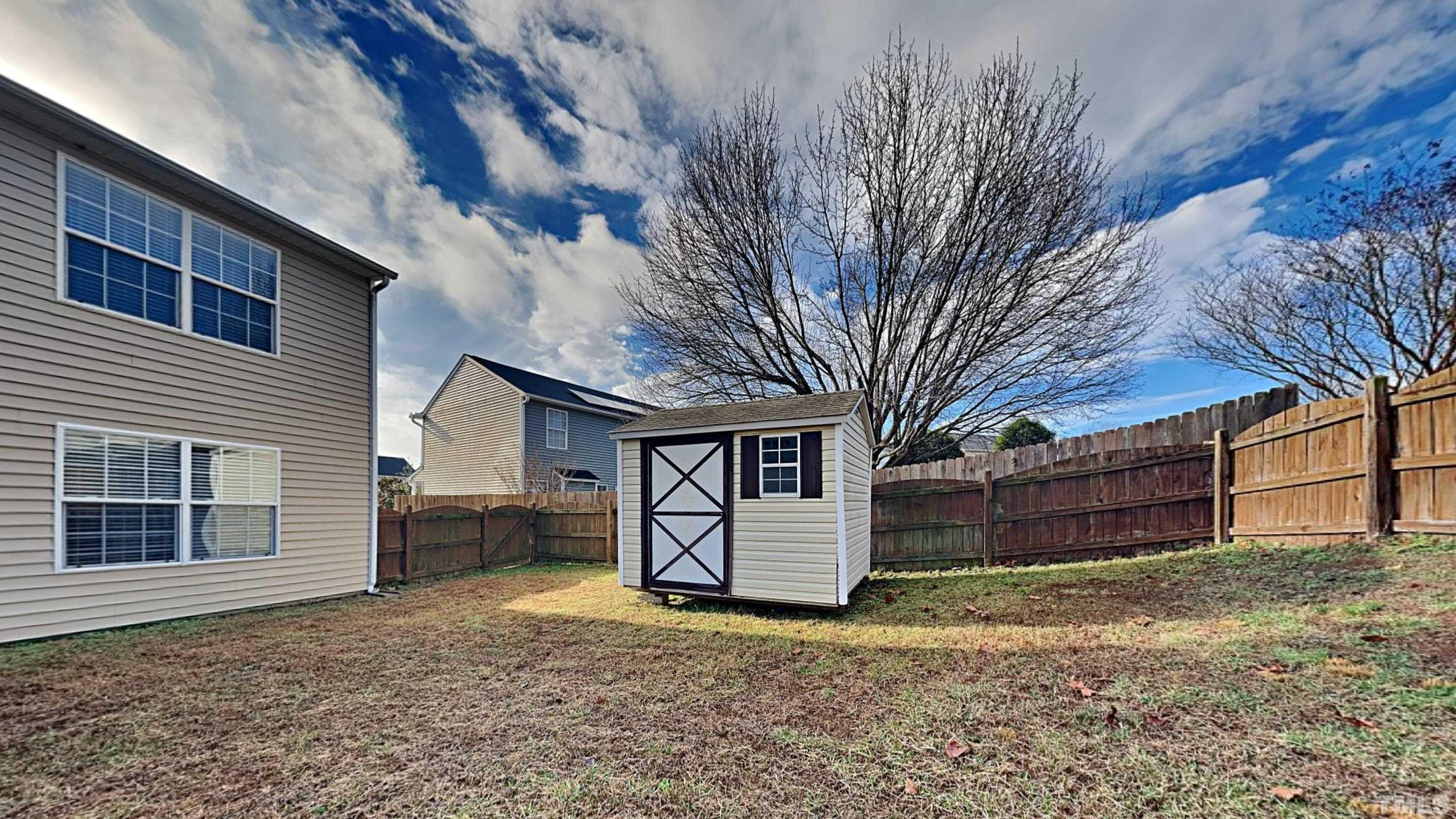 4105 Springfield Creek Drive Raleigh, NC 27616 - Photo 12 of 12 a backyard of a house