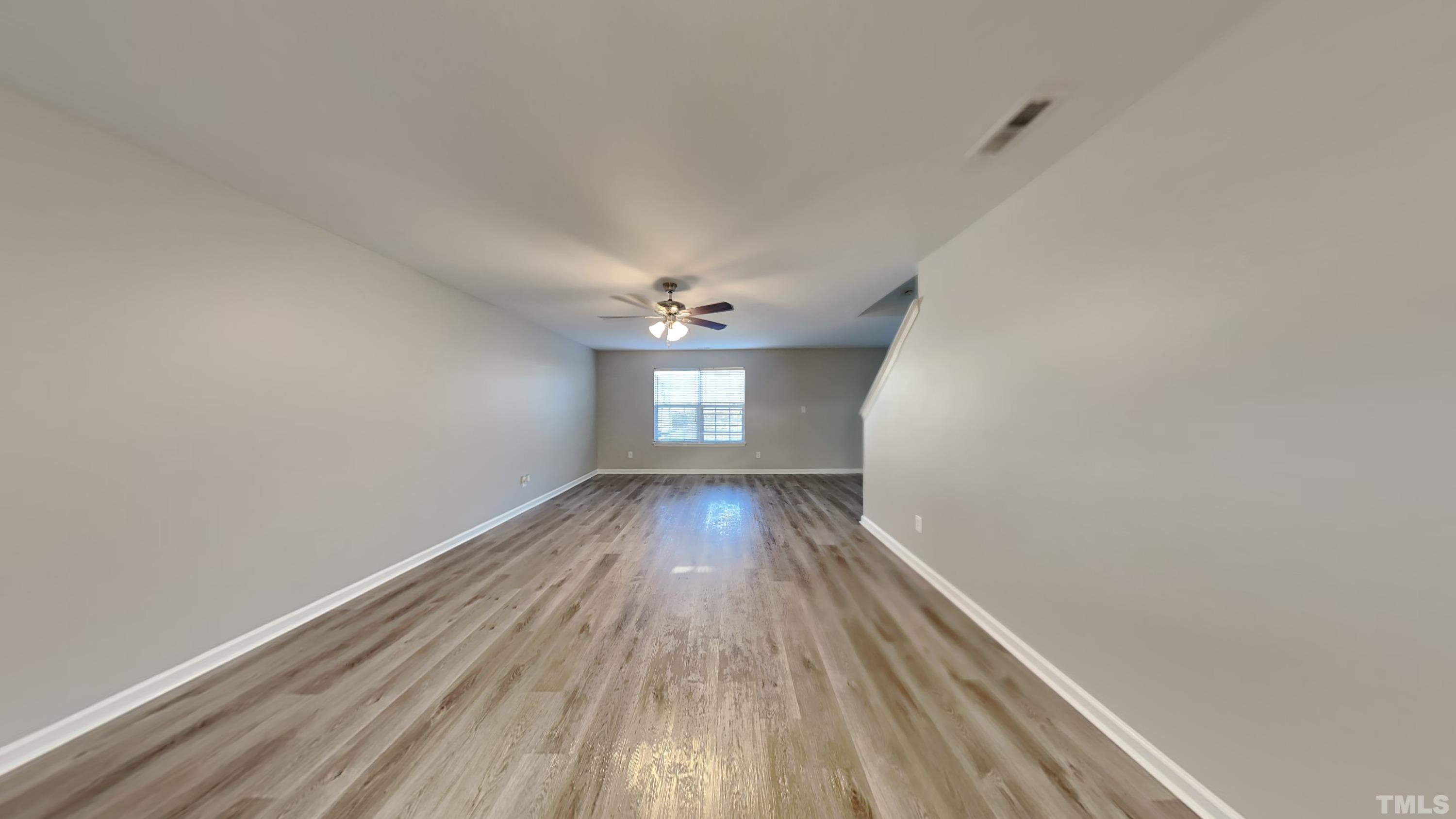 4105 Springfield Creek Drive Raleigh, NC 27616 - Photo 2 of 12 wooden floor in an empty room with a window