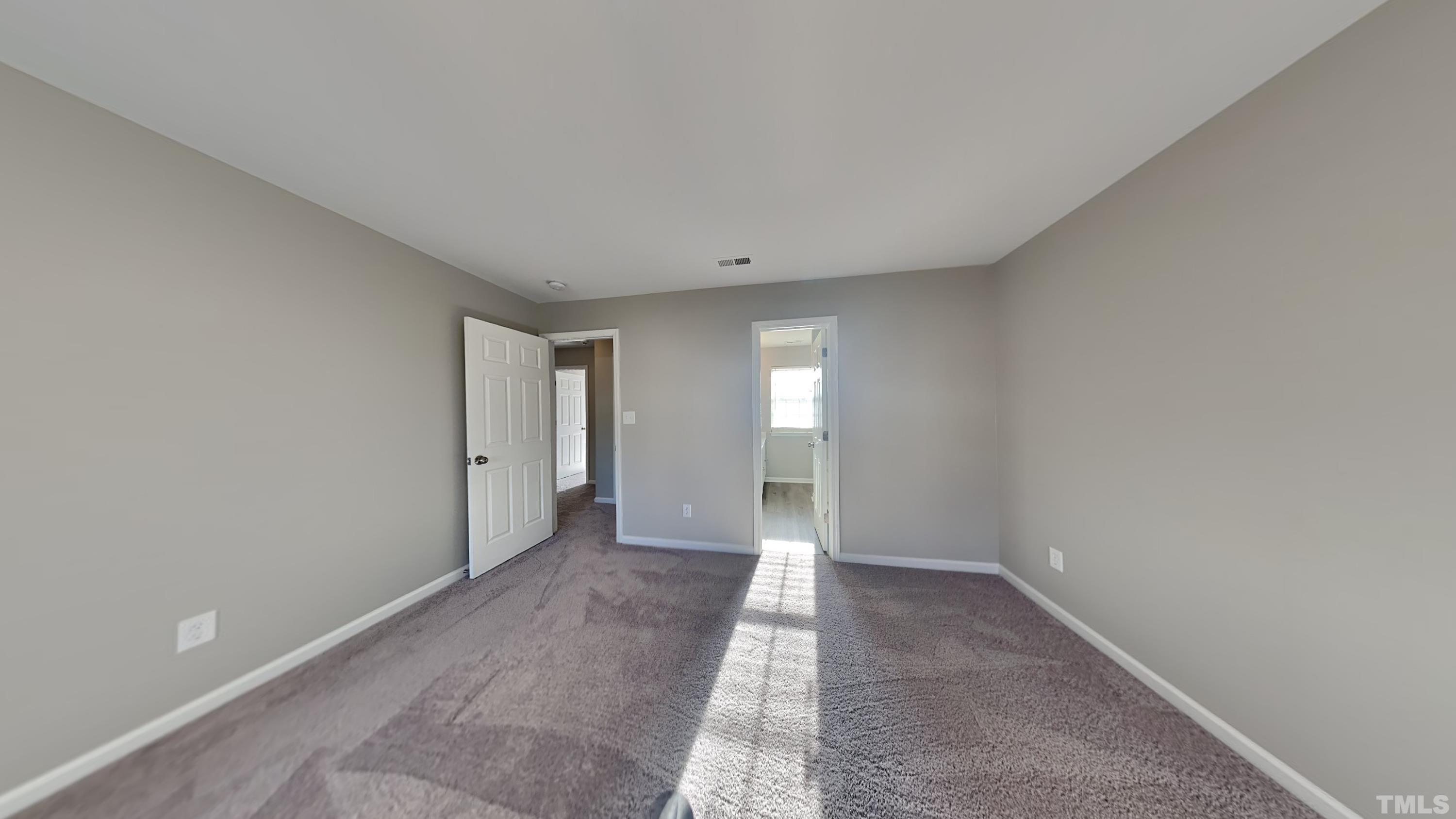 4105 Springfield Creek Drive Raleigh, NC 27616 - Photo 6 of 12 a view of an empty room