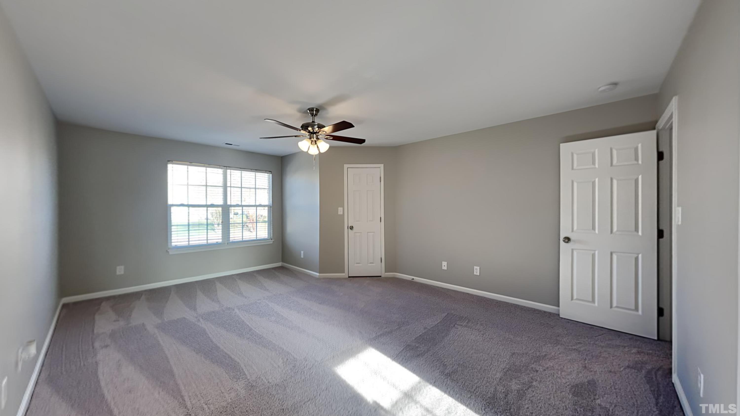 4105 Springfield Creek Drive Raleigh, NC 27616 - Photo 7 of 12 a view of an empty room with a window