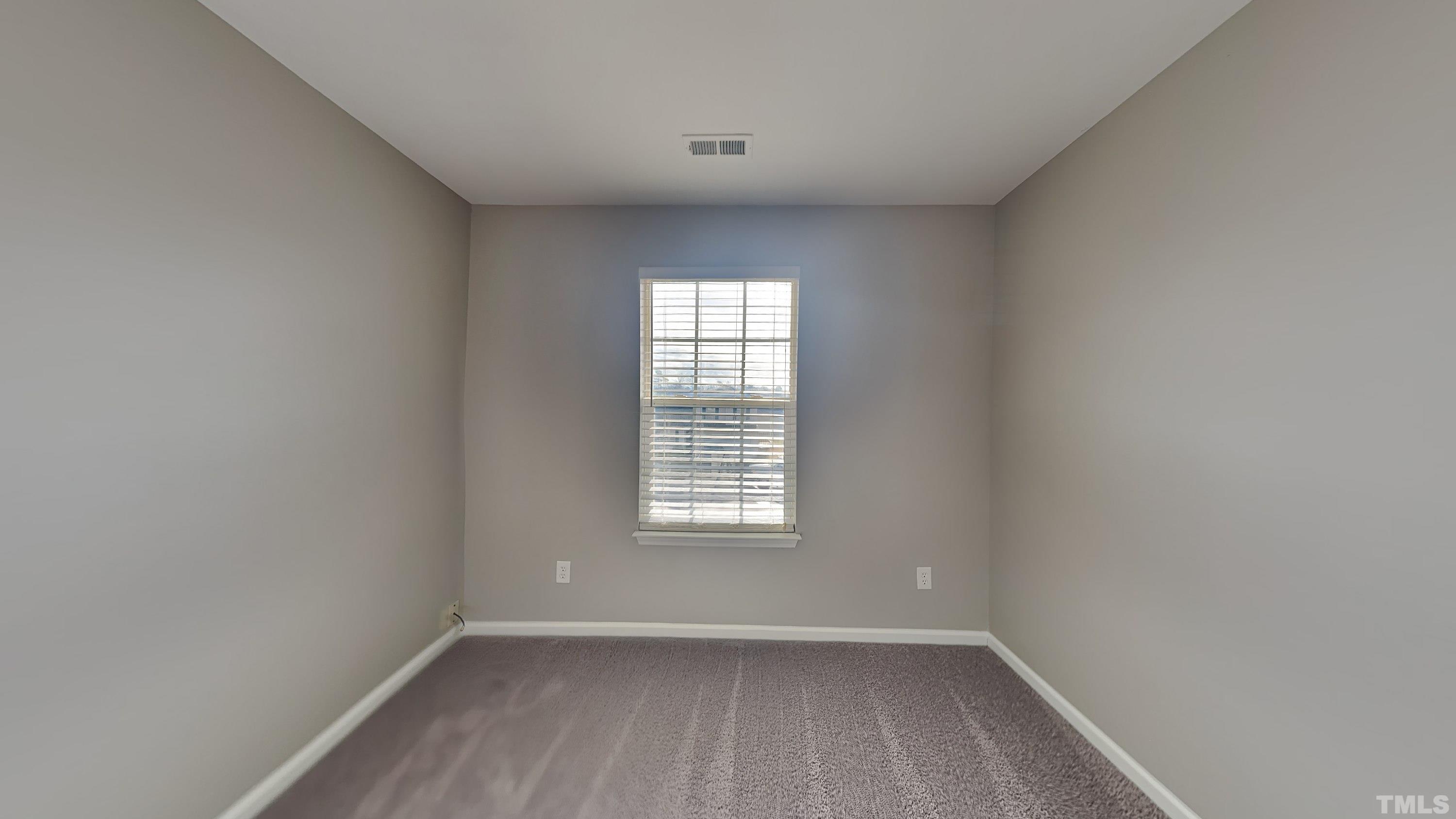 4105 Springfield Creek Drive Raleigh, NC 27616 - Photo 10 of 12 wooden floor in an empty room with a window
